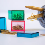 Triangle Stitch Markers - Metallic Gold Stainless in blue storage case