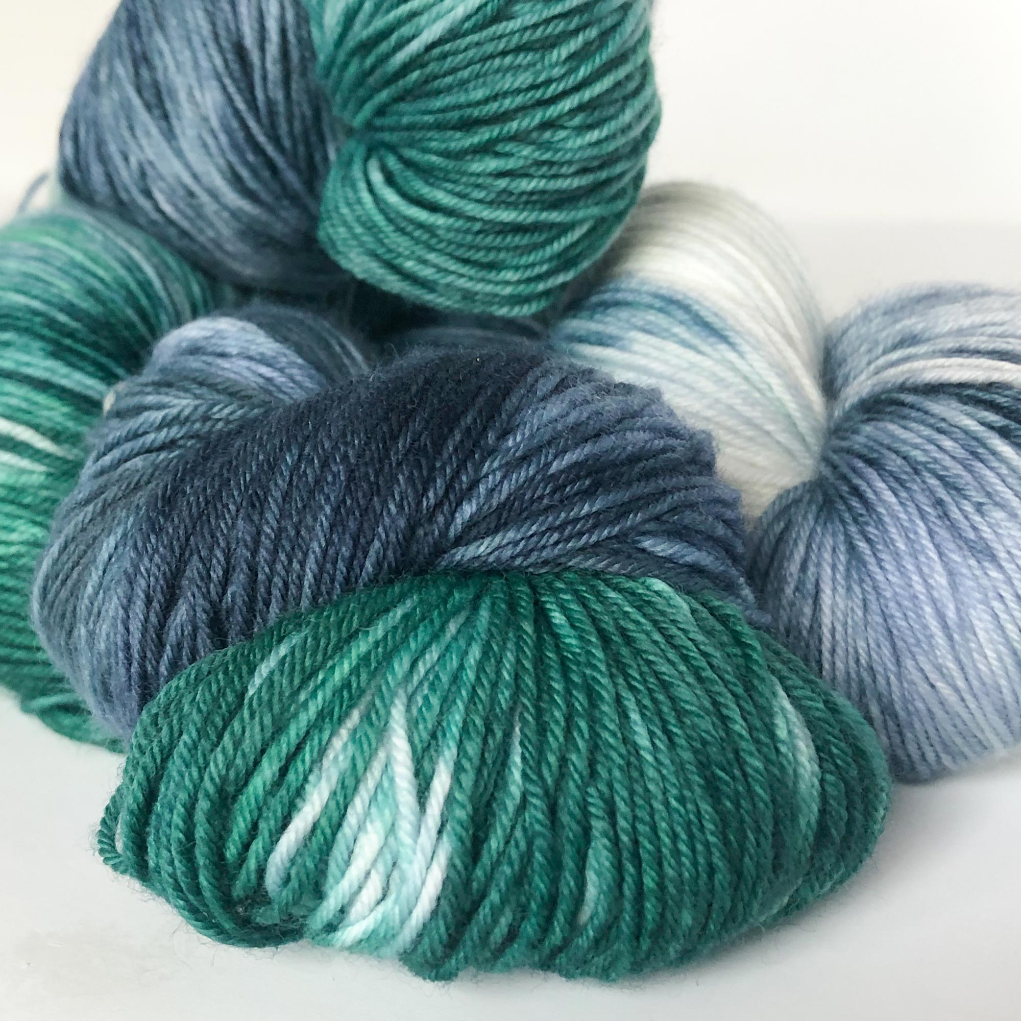 green and navy blue sock yarn close up