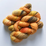 fall and autumn sock yarn - mix of orange, yellow and brown variegated fingering-weight extrafine merino wool yarn