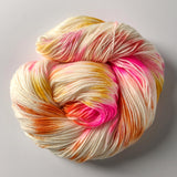 Confetti Cake Sock Yarn -- Fingering weight with various specks of pink, orange, and yellow.
