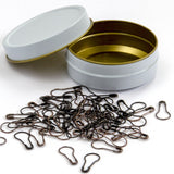 storage case for metal pear-shaped removable stitch markers is white and gold