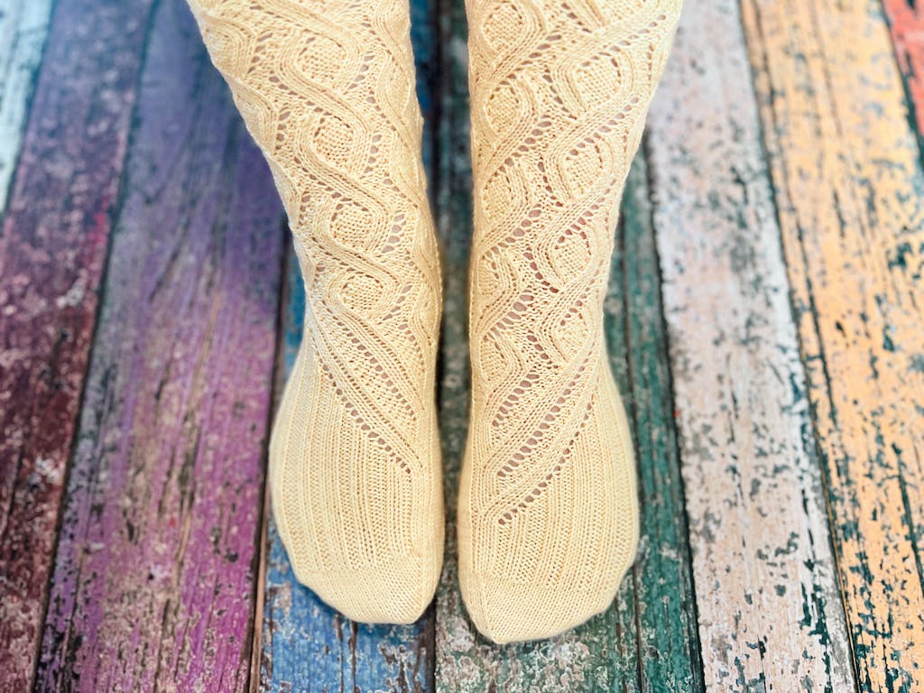 Photo and project by Pepper Hayes (@bombardgirl) using Global Backyard Mango Cream sock yarn