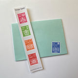 Sticker stamp strip includes Lucky Vibes art, Carpe Diem, Pinch of Love, and Hey Honey. Cozy Greetings postage stamp sticker shown decorating the gift car envelope.