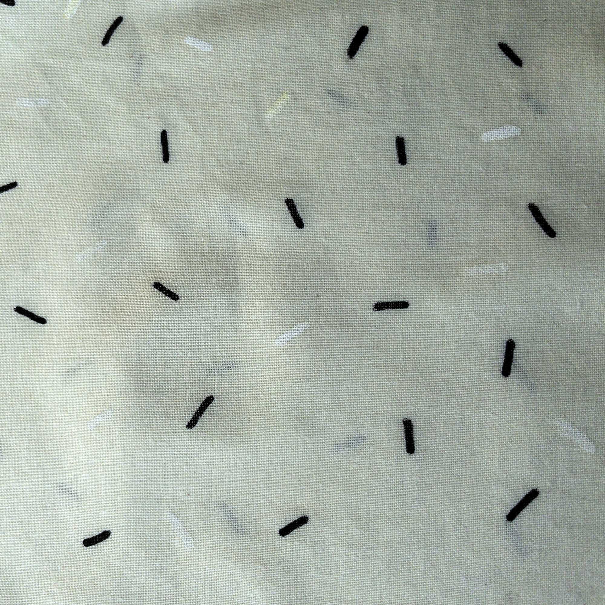 close up of colorful confetti pattern painted with black and white