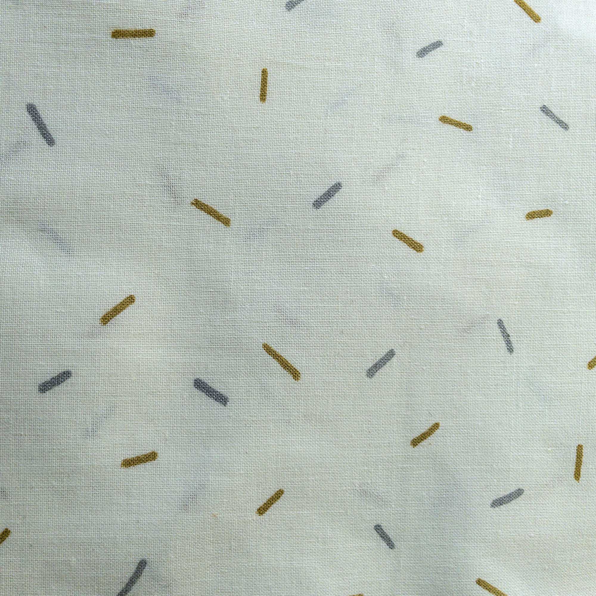 close up of colorful confetti pattern painted with gold and silver