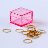 metallic gold circle stitch markers in pink storage box