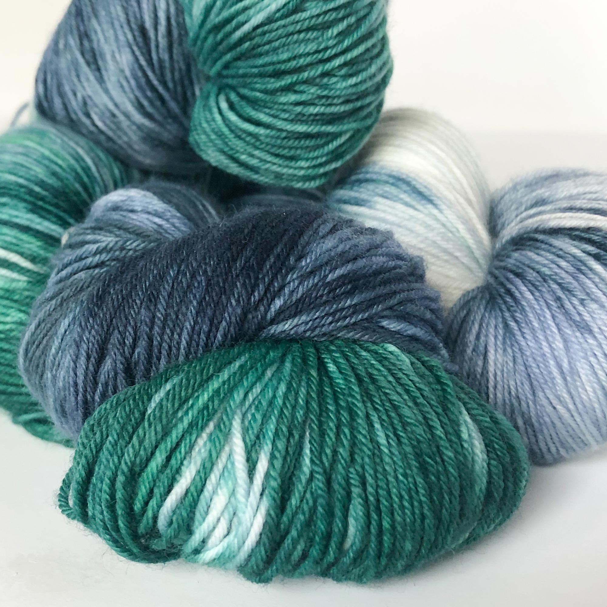 green and navy blue sock yarn close up 