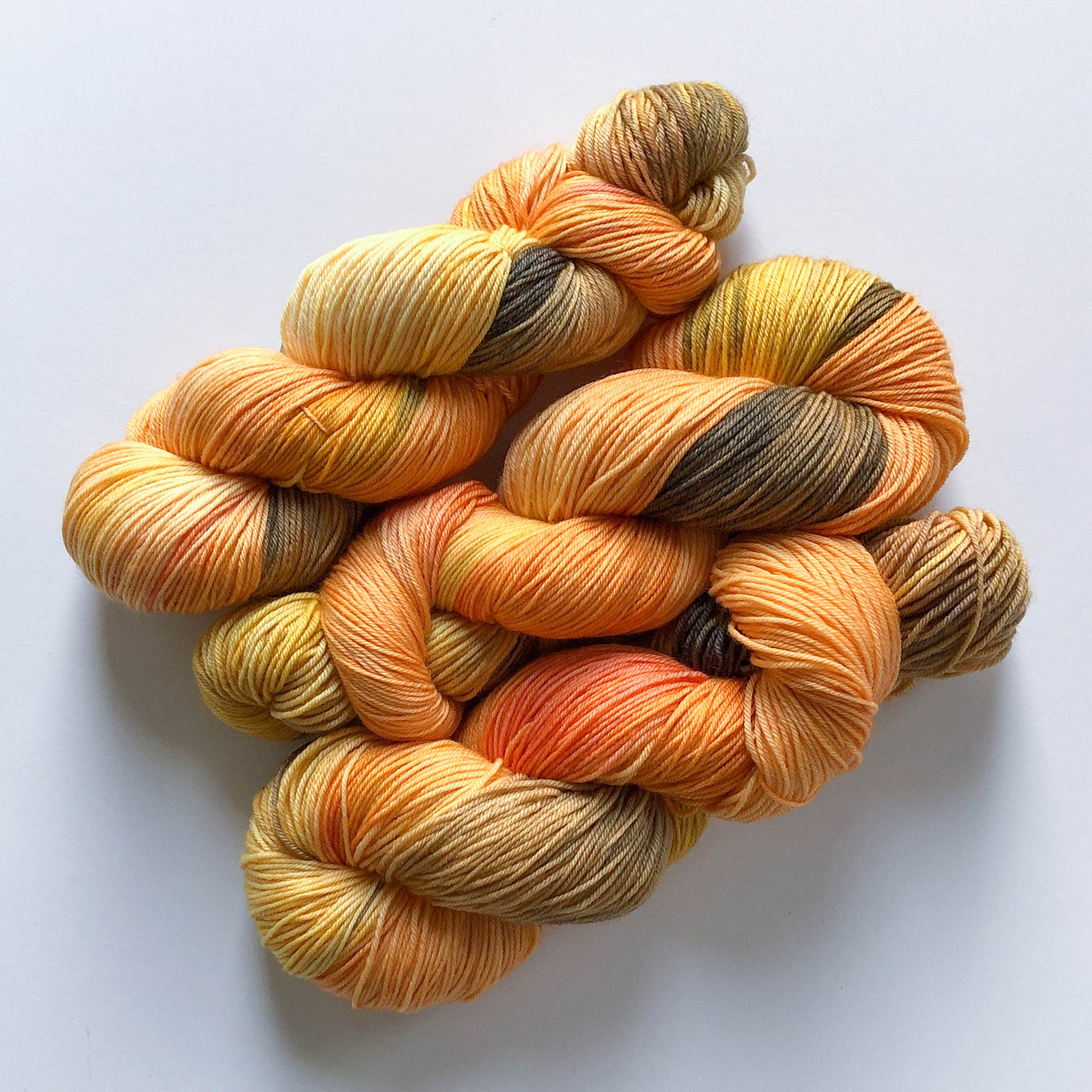 fall and autumn sock yarn - mix of orange, yellow and brown variegated fingering-weight extrafine merino wool yarn 