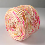 Confetti Cake Sock Yarn -- Fingering weight with various specks of pink, orange, and yellow.
