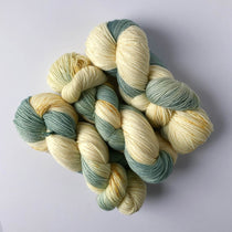 robin's egg blue with golden mustard speckles on a vanilla cream background -- good for assigned pooling projects 