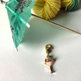 Happy Hour Mini-Skein Set comes with a cocktail charm stitch marker and a paper drink umbrella