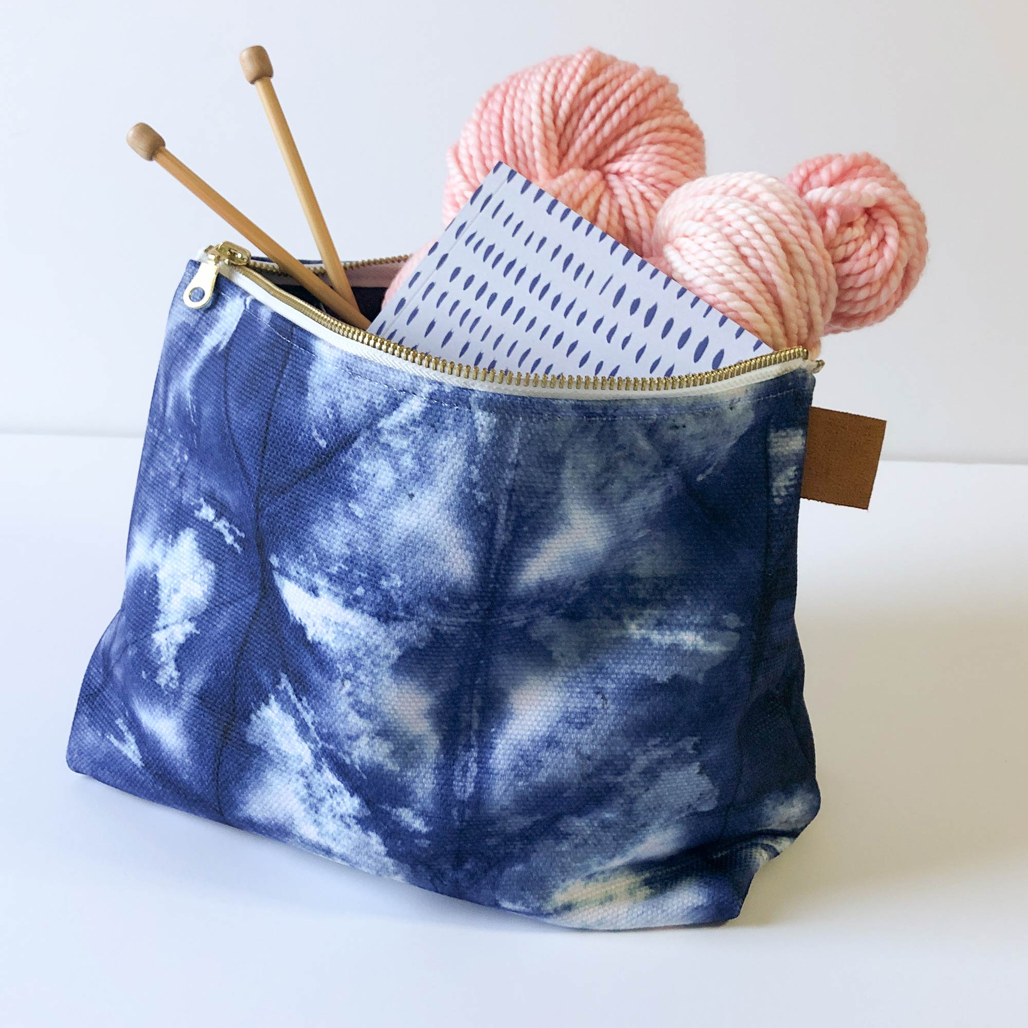 shibori indigo blue zipper pouch project bag for knitting and crochet -- with brass zipper and vegan brown leather side tab