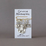 removable silver stitch marker set with a craft theme 
