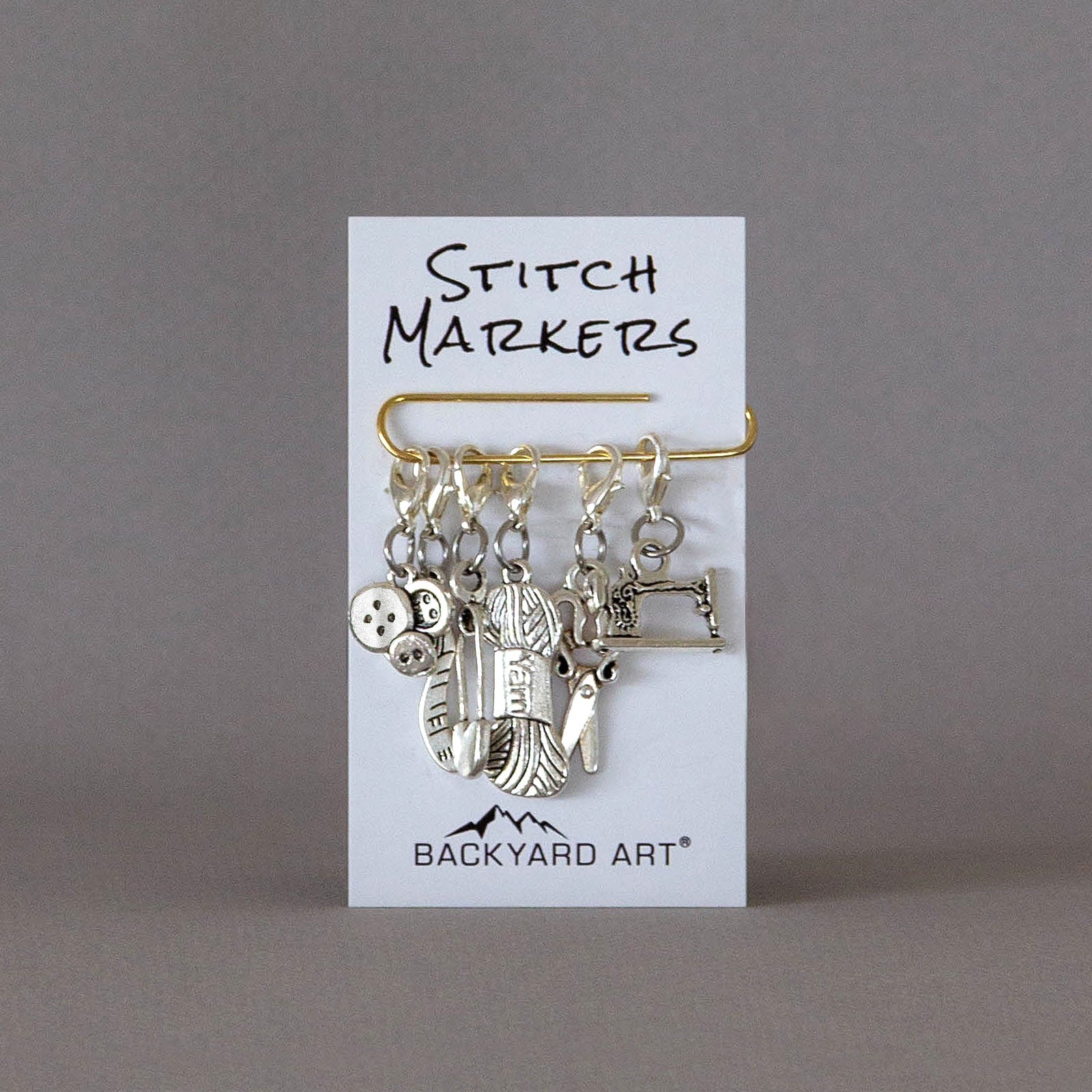 removable silver stitch marker set with a craft theme 
