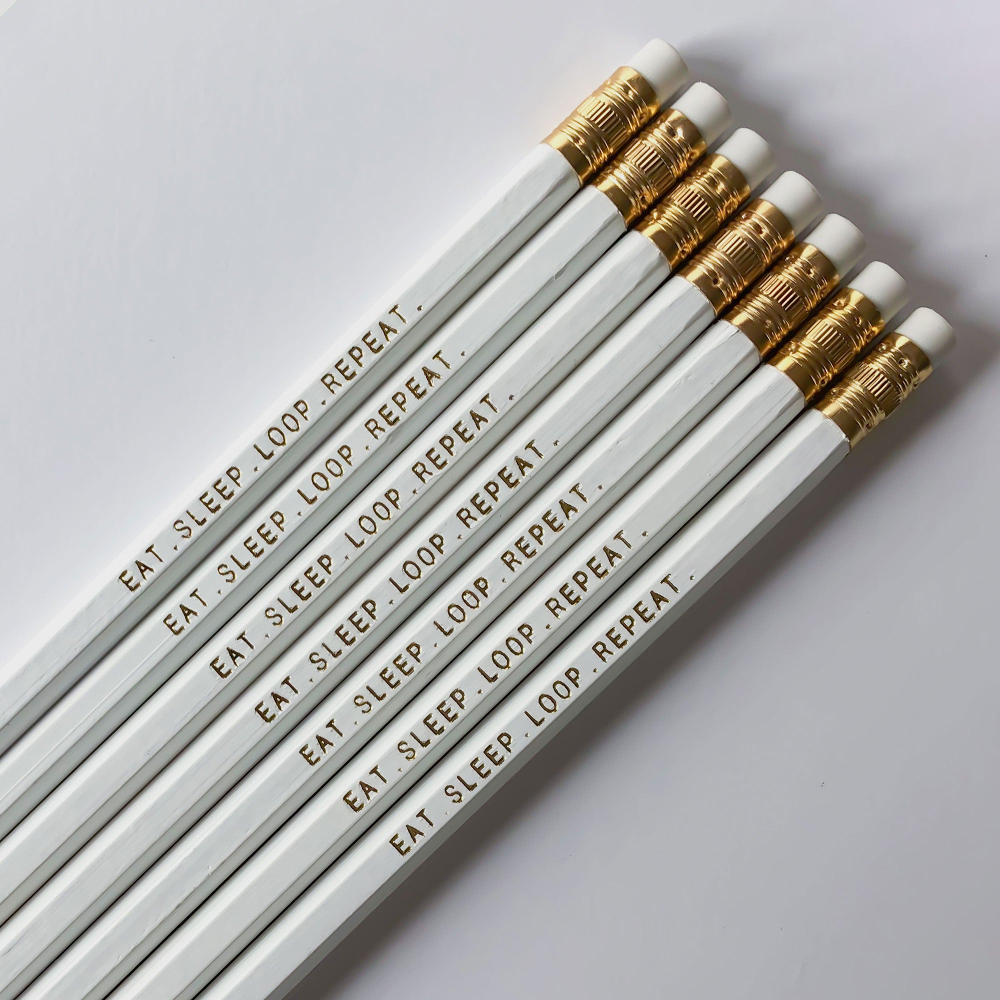 "Eat. Sleep. Loop. Repeat." is a pencil set for crocheters