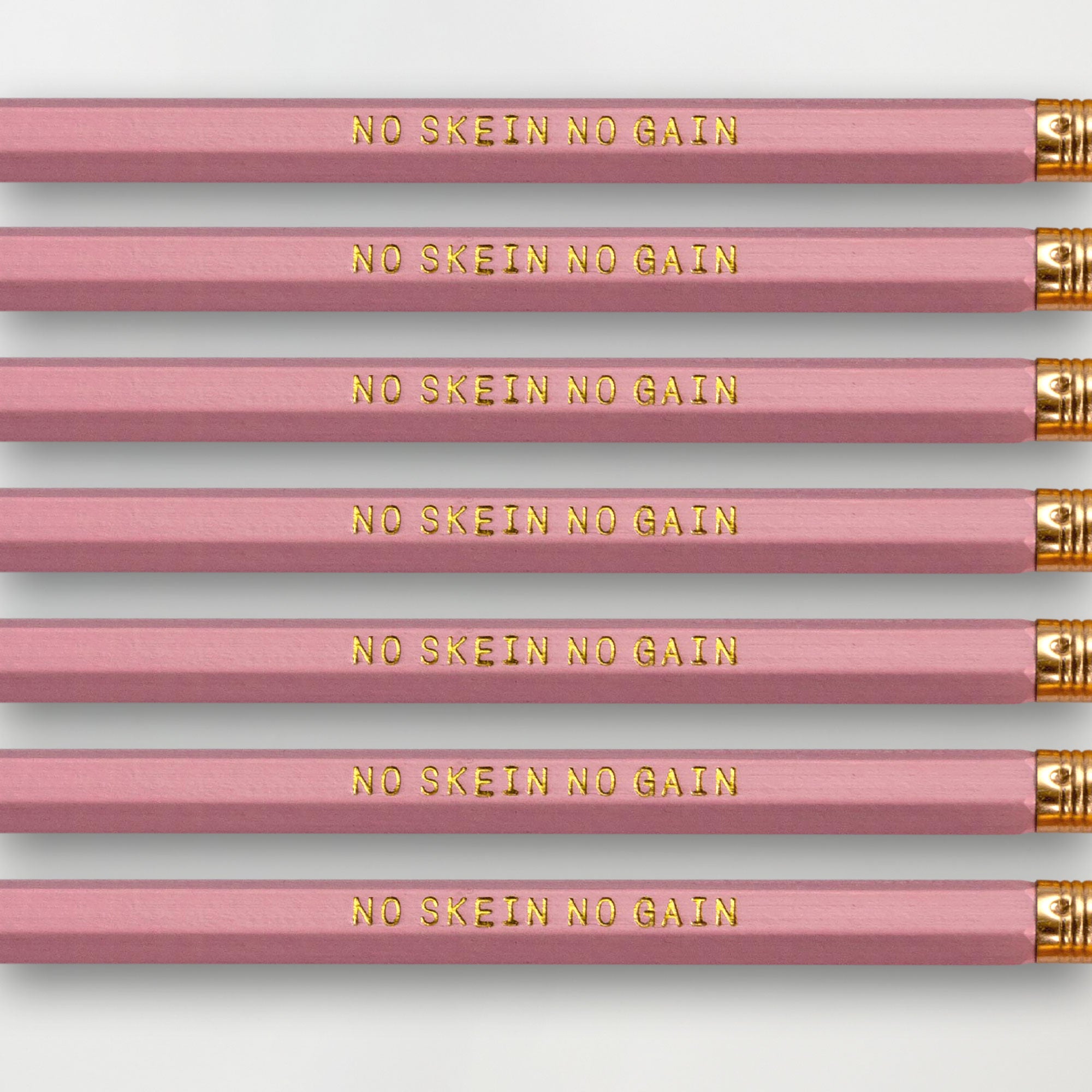 Novelty yarn themed pencil set for knitters and crocheters saying "just one more row" 