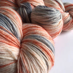 coral and silver gray space dyed sock yarn close up