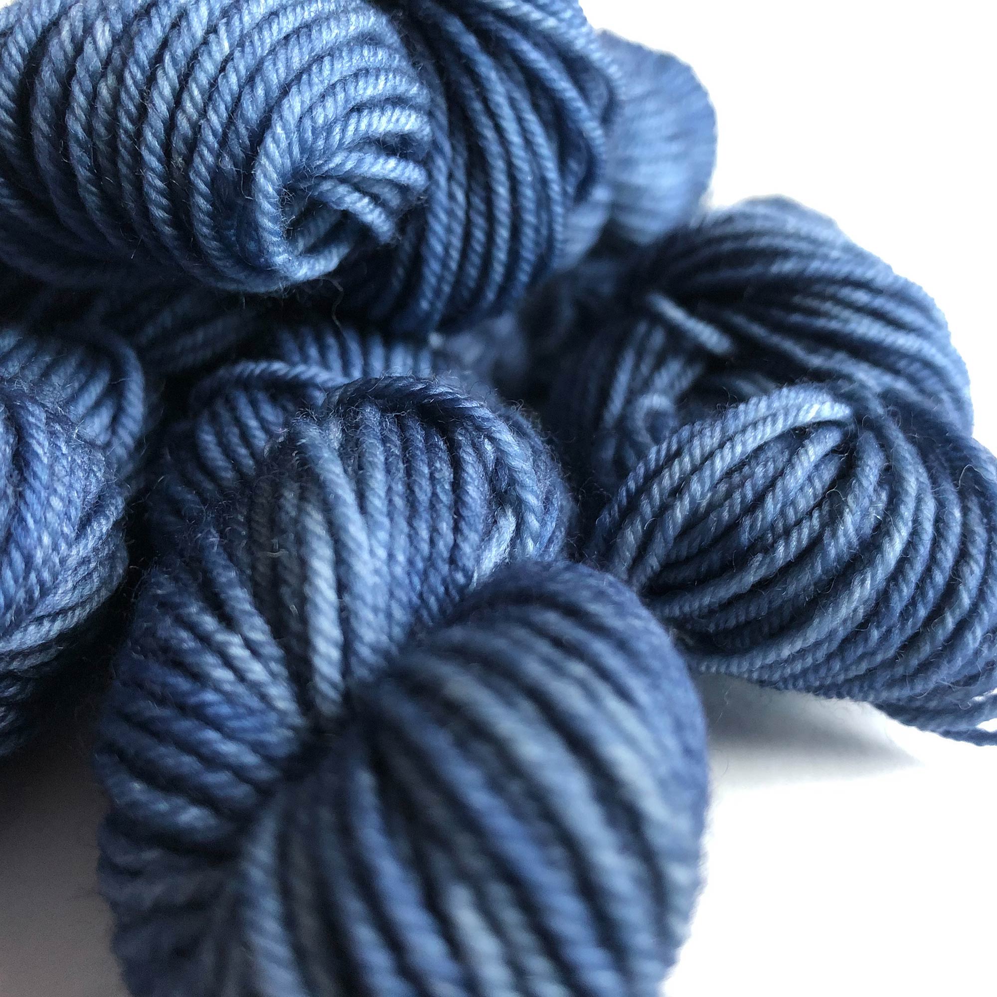 another close-up shows the tonality of the indigo on the sock yarn minis