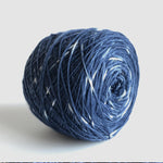 center pull cake of indigo blue and white sock yarn