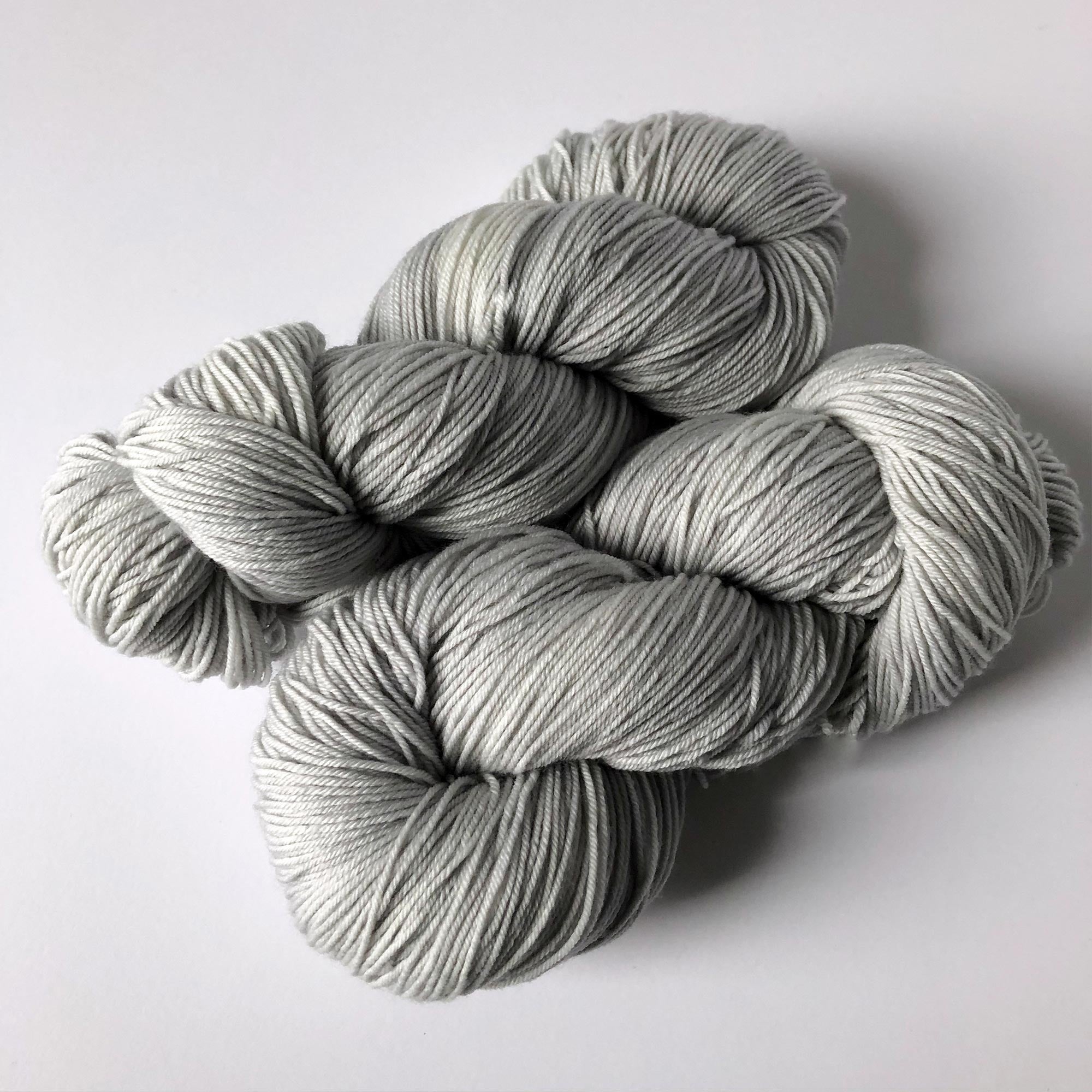 light silver gray slightly variegated yarn - extrafine merino/nylon fingering weight