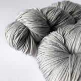 close-up of two silver gray yarn colors 