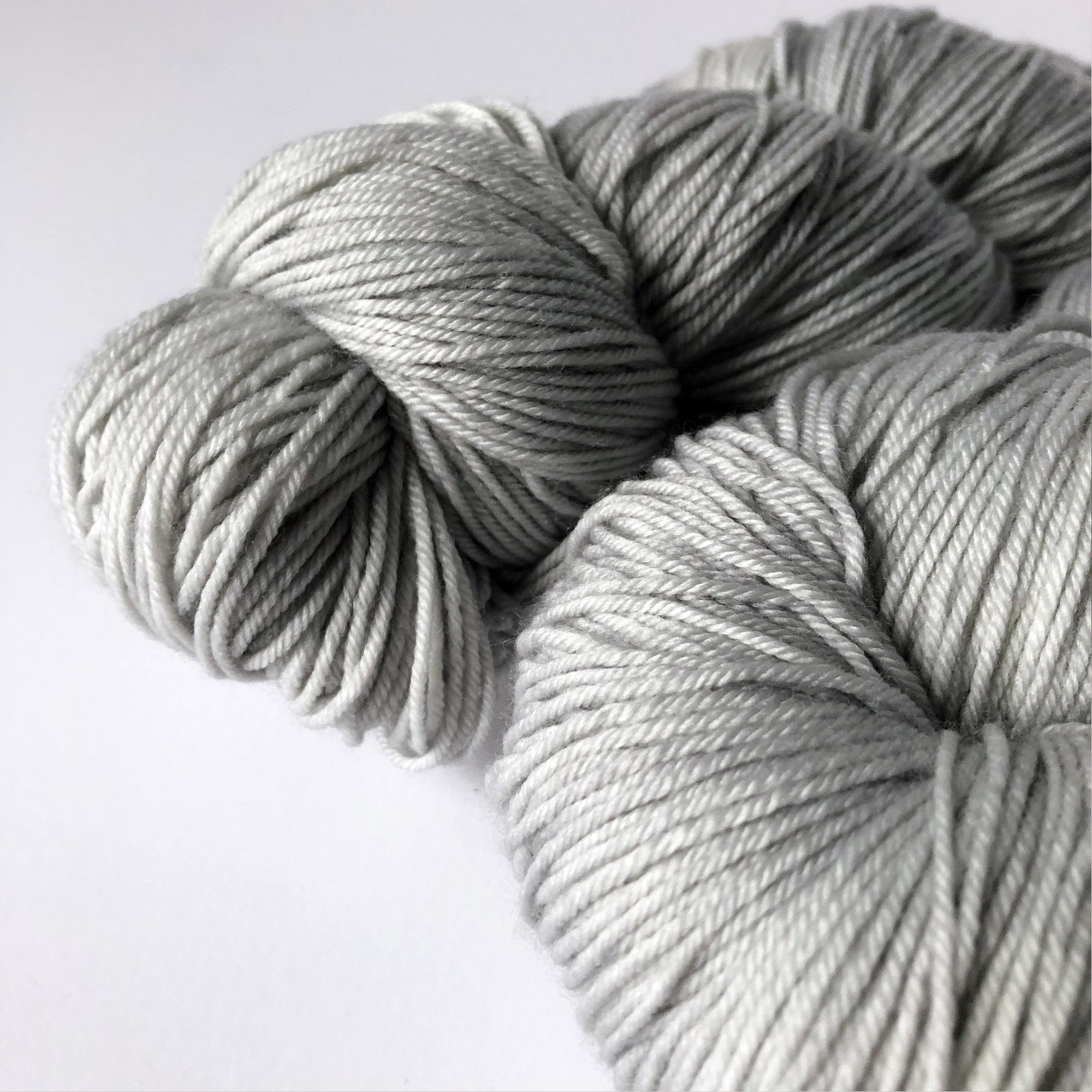 close-up of artisan yarn in gray "silver lining"  colorway