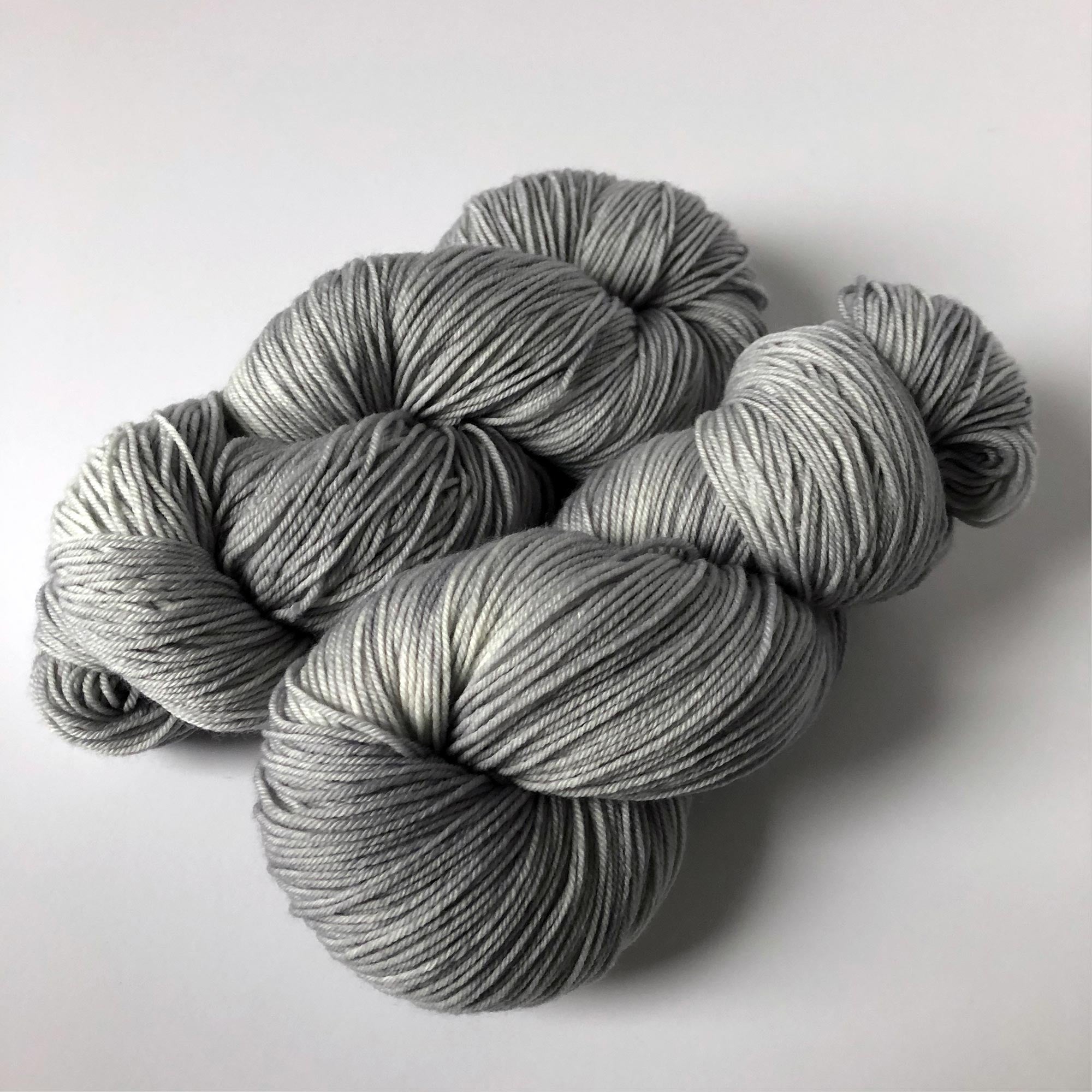 "silver lining" medium gray artisan sock yarn - slightly variegated 