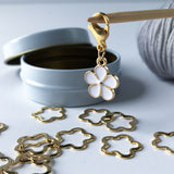 gold and white metallic stitch marker set - snagless knitting with its own storage tin