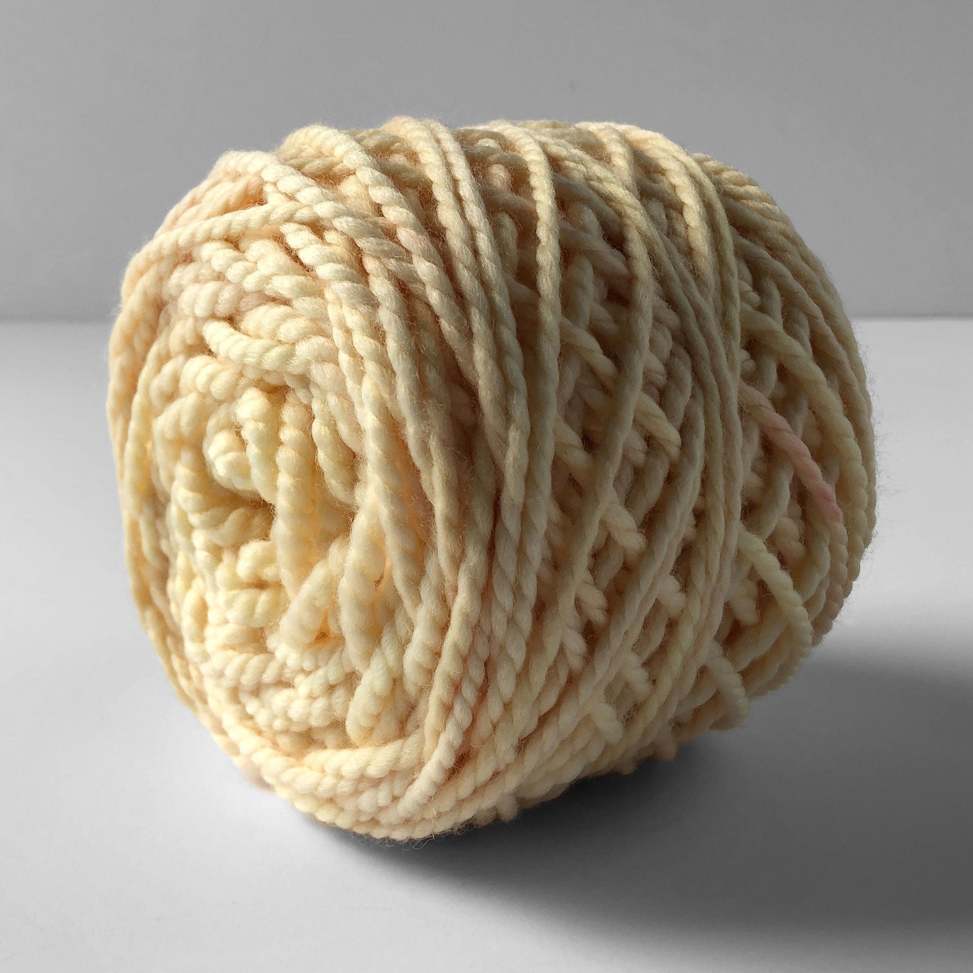 hand dyed chunky yarn shows the yellow-orange color