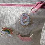 collection of global backyard enamel pins for knitters