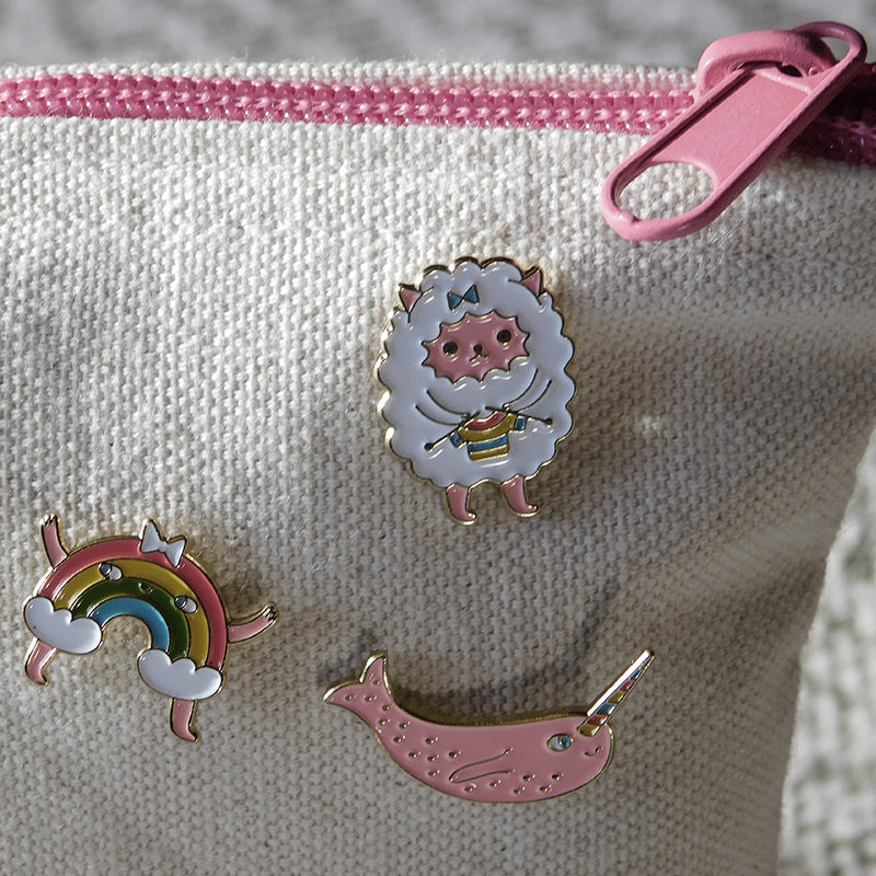 collection of global backyard enamel pins for knitters